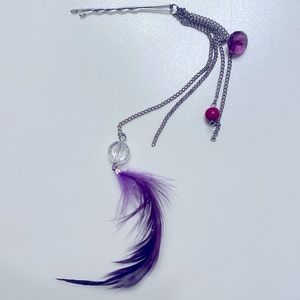 Purple feather hair accessory